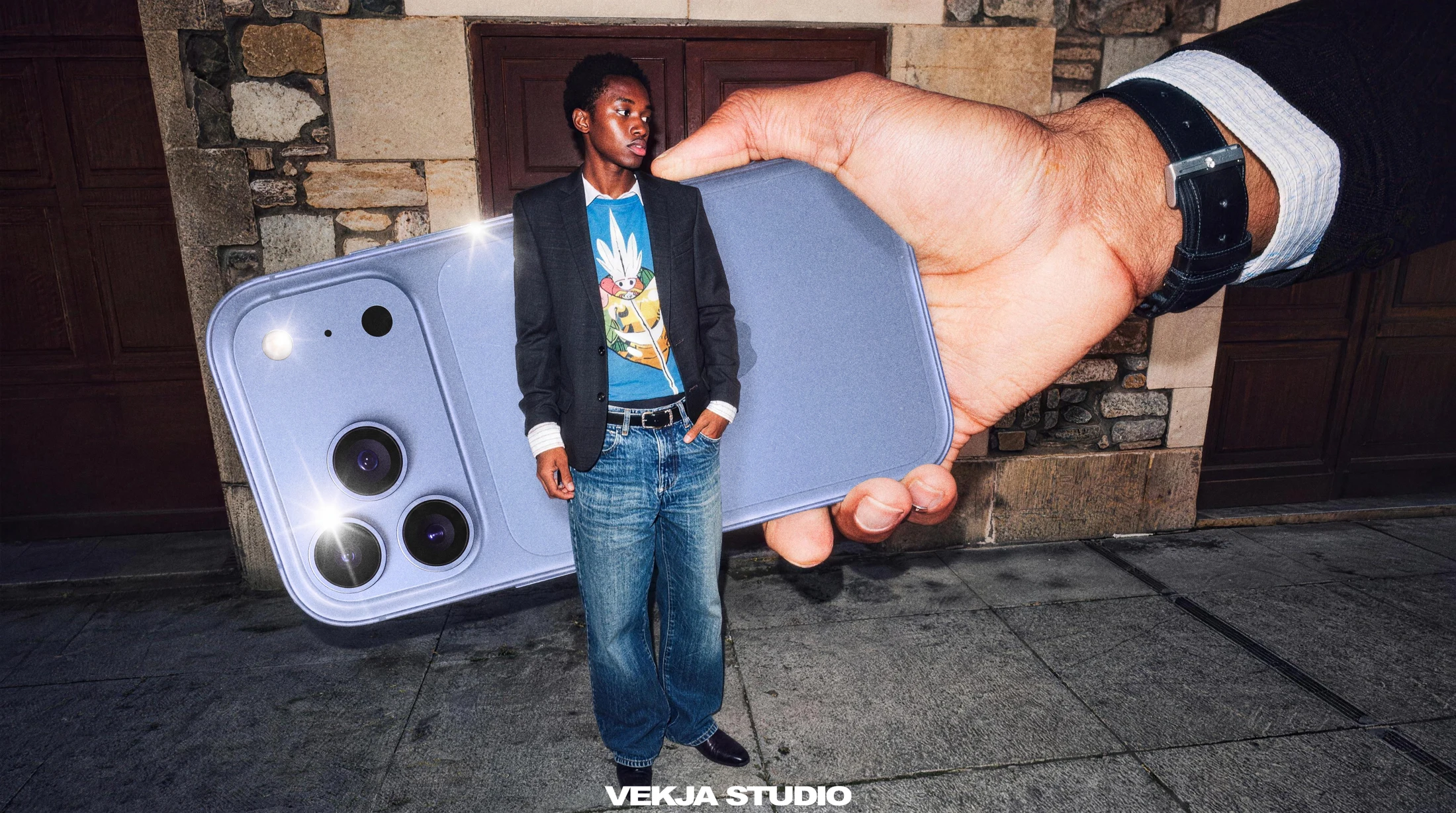 Playful scale contrast between a man and a handheld phone