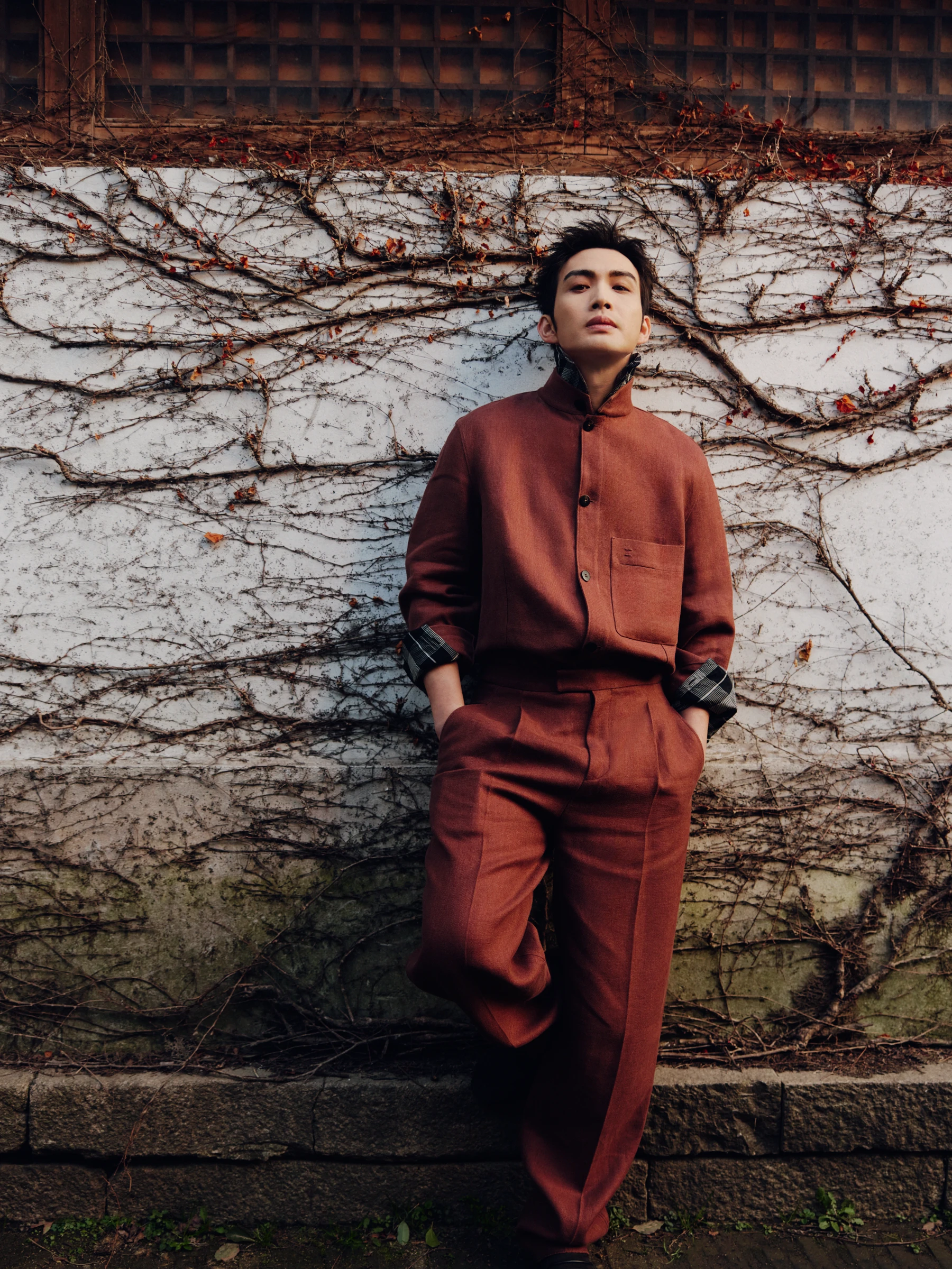 GRAZIA editorial portrait against a vine-covered wall
