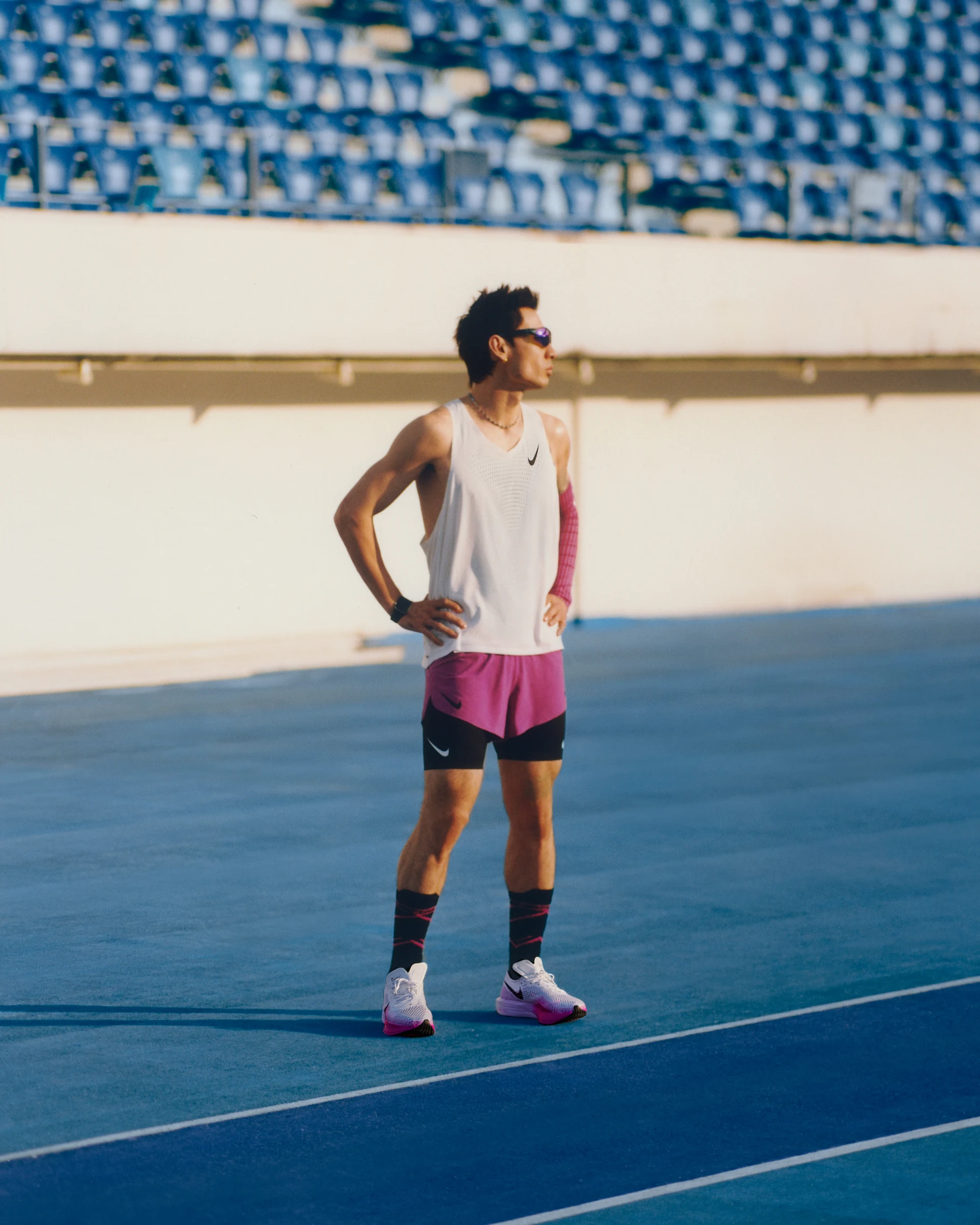 NIKE running portrait on a blue track